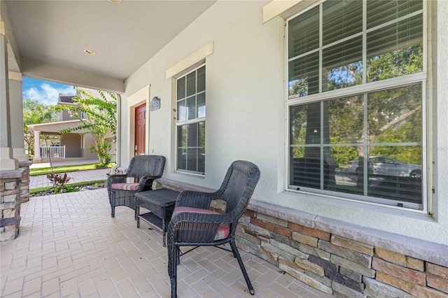 view of patio featuring a porch