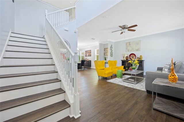 interior space with crown molding, dark wood-type flooring, and ceiling fan