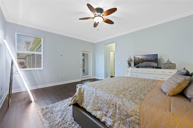 bedroom featuring ornamental molding, dark wood-type flooring, and ceiling fan