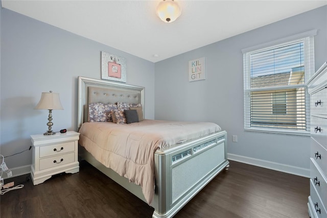 bedroom with dark wood-type flooring