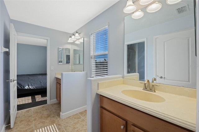 full bath featuring tile patterned floors, visible vents, connected bathroom, and vanity