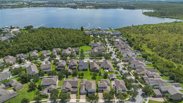 birds eye view of property with a water view and a residential view