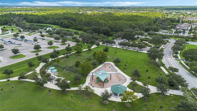 birds eye view of property featuring a view of trees