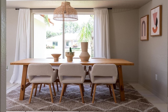 dining space with tile patterned floors