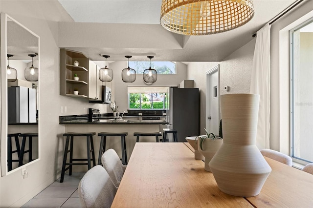 dining area with light tile patterned floors