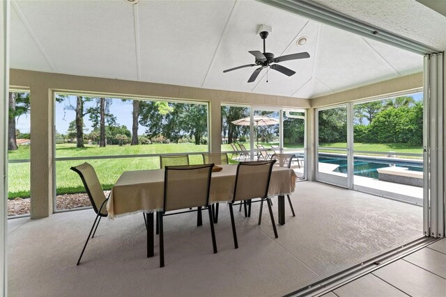 sunroom / solarium featuring ceiling fan