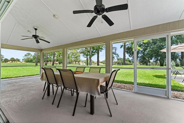 sunroom with lofted ceiling and ceiling fan