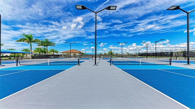 view of sport court featuring basketball hoop