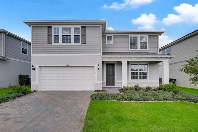 front of property with a garage and a front yard