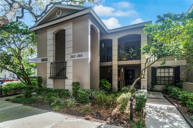 view of front of house with a balcony