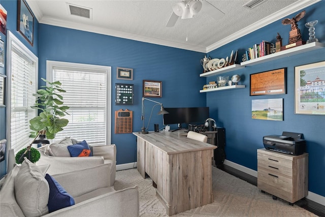 office area featuring a textured ceiling, ceiling fan, and crown molding