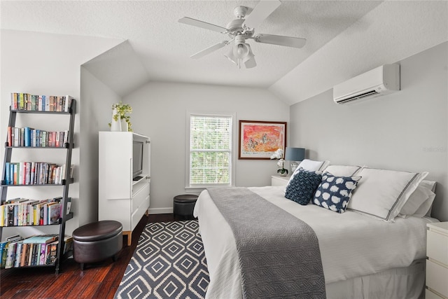 bedroom featuring lofted ceiling, ceiling fan, a wall mounted AC, and dark wood-type flooring