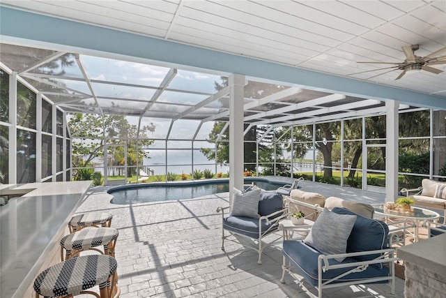 view of patio featuring a lanai