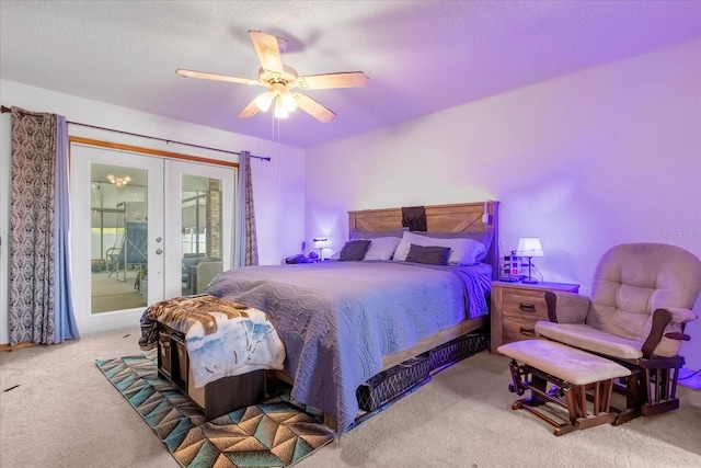 bedroom with a ceiling fan, access to outside, a textured ceiling, french doors, and carpet floors