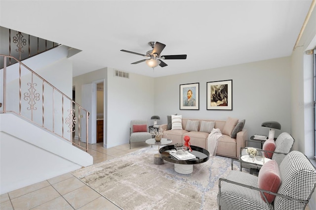 living room featuring ceiling fan and light tile patterned floors