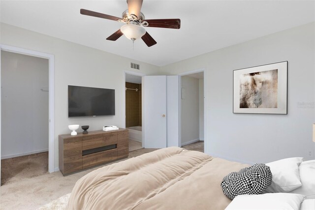 bedroom featuring light colored carpet, visible vents, and baseboards