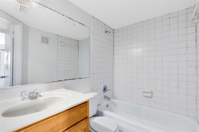 bathroom featuring toilet, washtub / shower combination, visible vents, and vanity