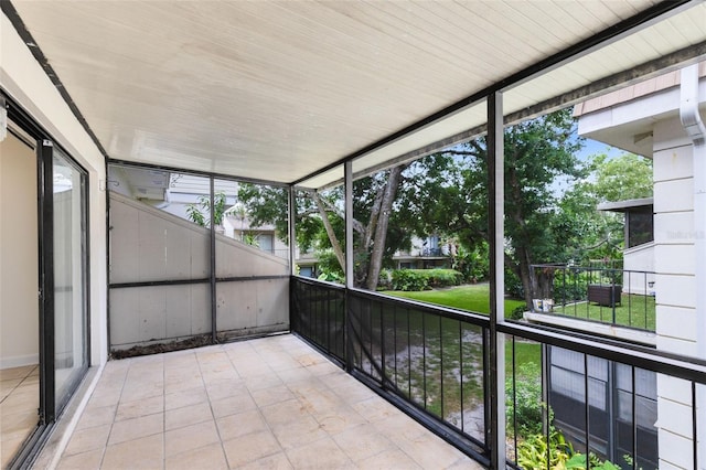 unfurnished sunroom with a wealth of natural light