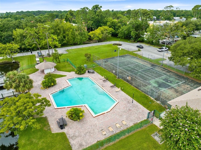 pool with a gazebo, a patio, and fence