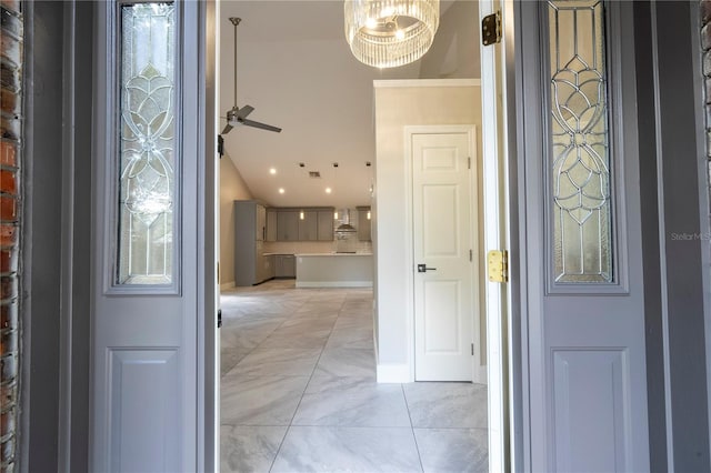 foyer entrance featuring a notable chandelier