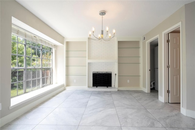 living room featuring built in shelves, plenty of natural light, and a fireplace