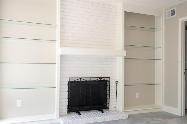 interior details featuring a fireplace and visible vents