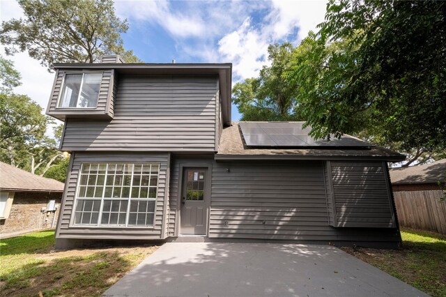 view of front of home with solar panels