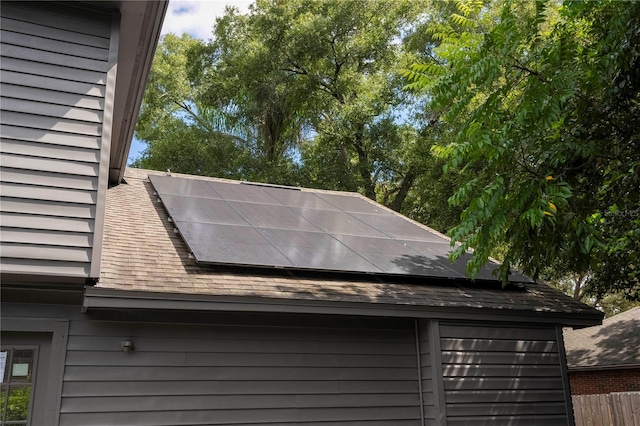 view of property exterior with solar panels