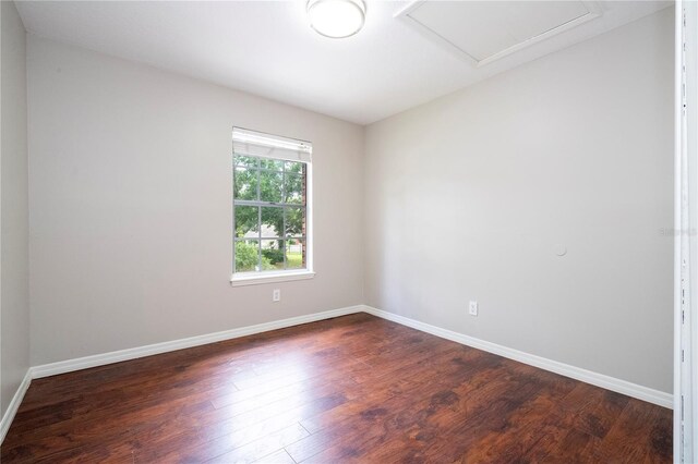 spare room featuring dark hardwood / wood-style flooring