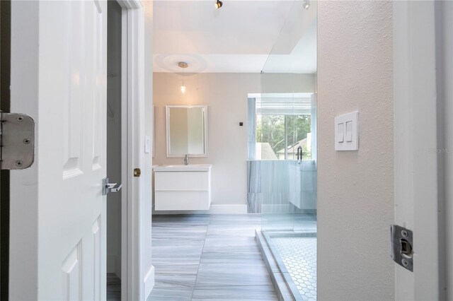 bathroom featuring vanity and baseboards