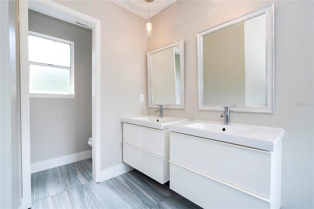 bathroom featuring toilet and vanity