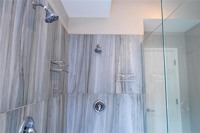 bathroom with a tile shower