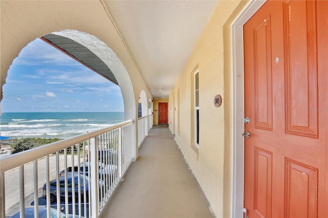 balcony featuring a water view