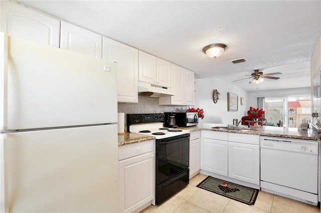 kitchen featuring ceiling fan, light tile patterned floors, white appliances, and white cabinetry