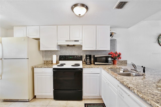 kitchen featuring sink, white appliances, white cabinets, and light tile patterned floors