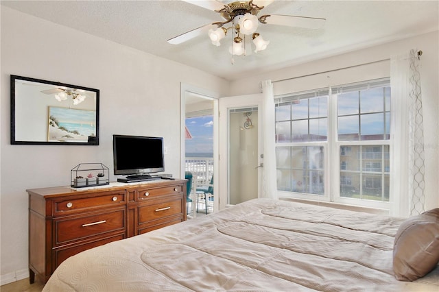 bedroom featuring ceiling fan and a closet