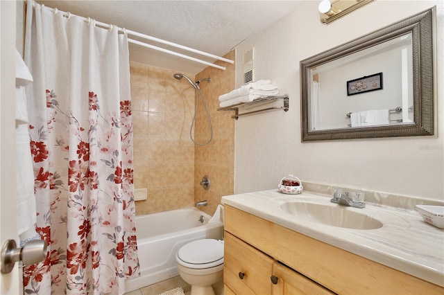 full bathroom featuring shower / bath combo with shower curtain, a textured ceiling, vanity, and toilet