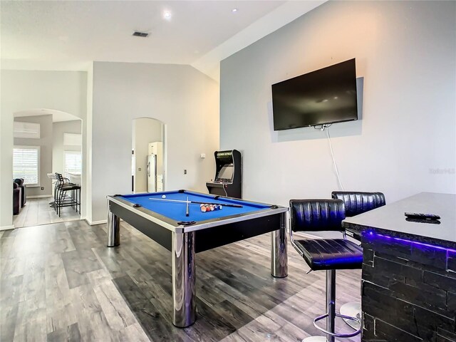 rec room featuring pool table, wood-type flooring, and vaulted ceiling