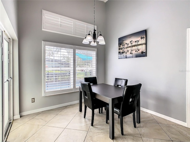 dining area with an inviting chandelier and light tile patterned floors