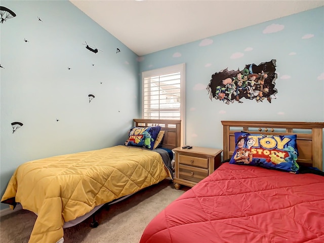 carpeted bedroom featuring vaulted ceiling