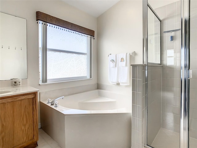 bathroom featuring vanity, separate shower and tub, and tile patterned floors