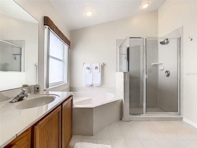 bathroom with tile patterned flooring, vanity, separate shower and tub, and vaulted ceiling