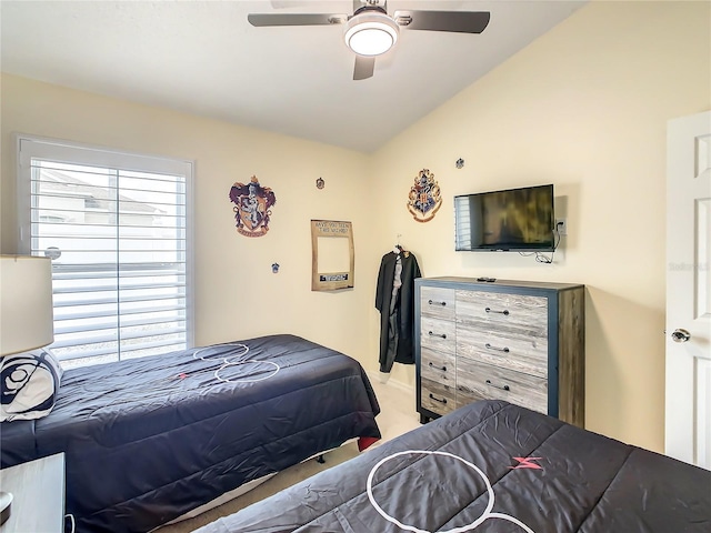 carpeted bedroom with vaulted ceiling, multiple windows, and ceiling fan