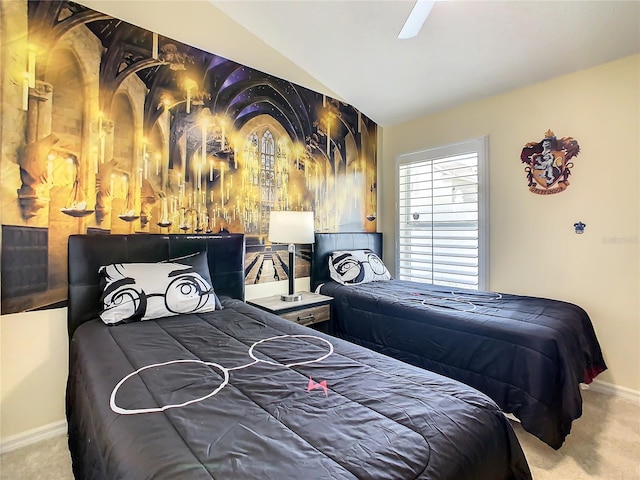 carpeted bedroom with ceiling fan and vaulted ceiling