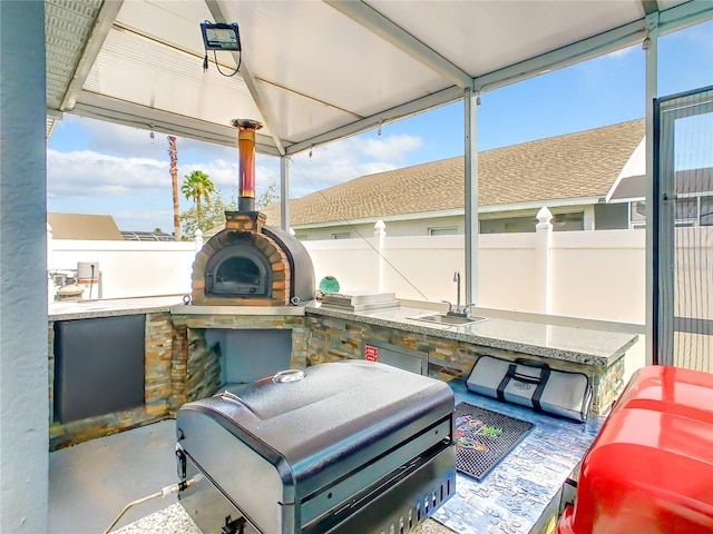 sunroom / solarium with a sink