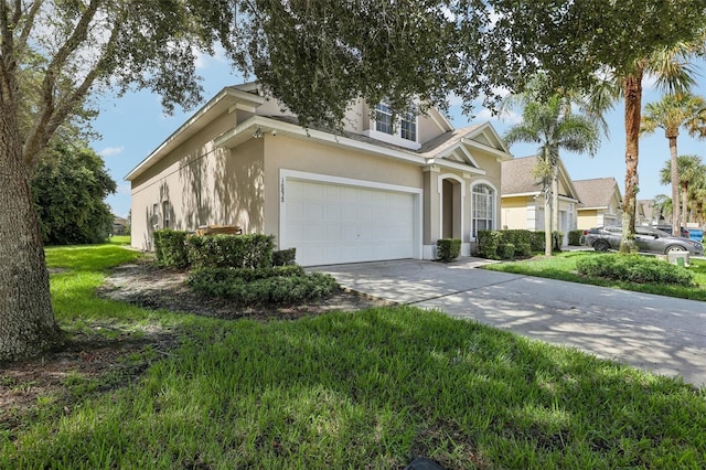 view of front of property with a garage and a front yard