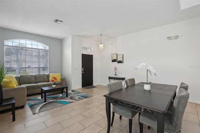 dining room featuring light tile patterned flooring