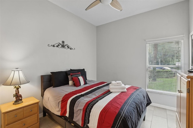 tiled bedroom with ceiling fan