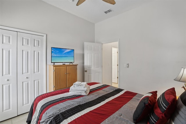 tiled bedroom with a closet and ceiling fan