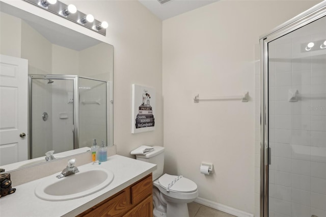 bathroom with vanity, toilet, tile patterned floors, and walk in shower